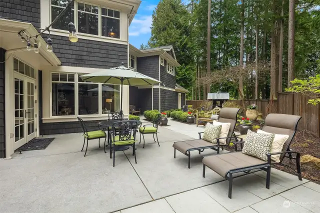 13,713 square feet of lush, professionally landscaped grounds with French doors to south-facing massive entertaining patios including large covered outdoor patio with fireplace, mature plantings and beautiful formal gardens.