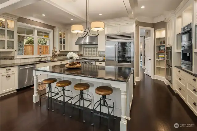 Huge true epicurean island kitchen with Subzero Pro 48” glass door refrigerator, top-of-the line Dacor & Meile appliances