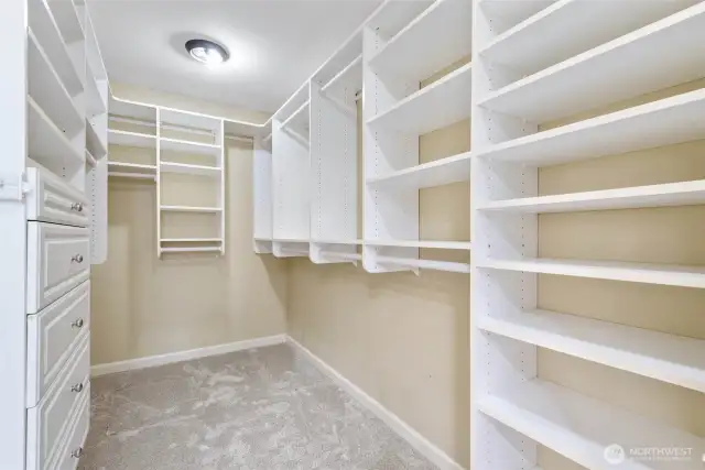 One of two walk-in closets in the primary bedroom.