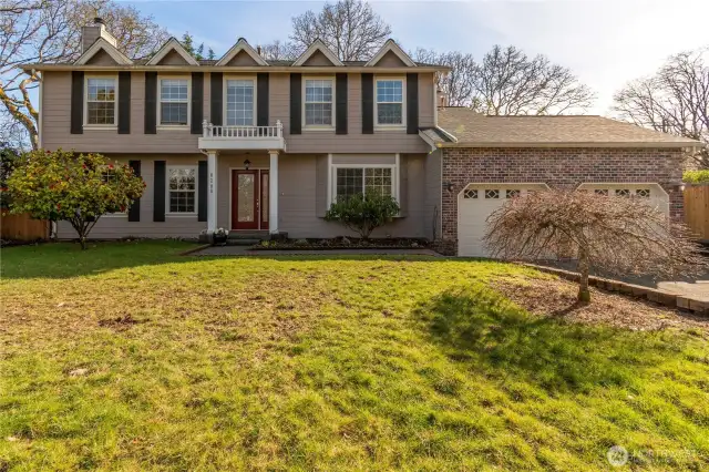 American Dutch Colonial with "Doghouse Dorners" added for space and light for front bedrooms. Pillars at covered Front Porch, decorative porch above. 4 BD 3BA