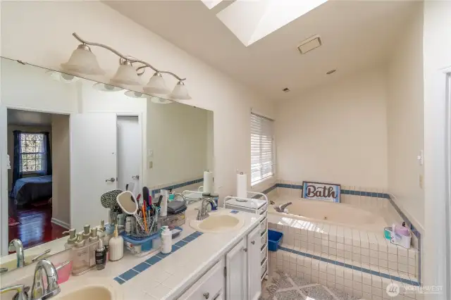 Upstairs bathroom with soaking tub, separate shower double vanity.