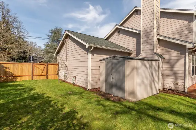 Close up of outbuilding and gate to front yard.