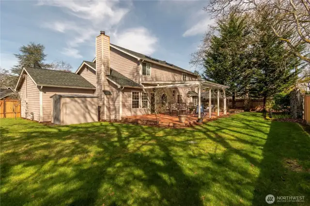 Lot size is 9,201 SQ FT Plenty of room for entertaining or playing games. All fenced with newer cedar fencing. Outbuilding for tools.