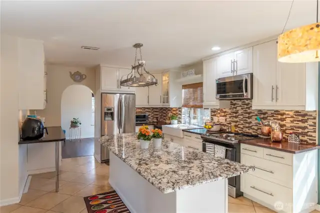 Large kitchen off dining room and family room. Direct entrance to kitchen along travertine stone hallway.