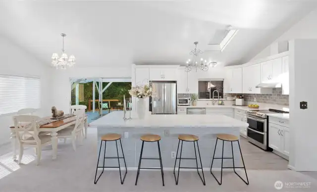 The heart of connection! With the dividing wall gone and this spacious island added, the kitchen becomes the perfect place to gather and engage.