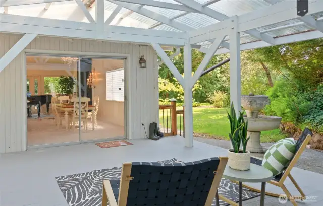 WOW, talk about outdoor living! This massive covered deck was just installed last year, offering incredible space. And look at that fantastic flat, grassy area – perfect for playtime with little ones or furry friends!