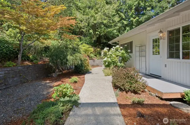 Think of the effortless convenience! The door on the right leads directly from one of the upstairs bedrooms to the outdoors, offering instant connection with nature and tranquility whenever you wish.