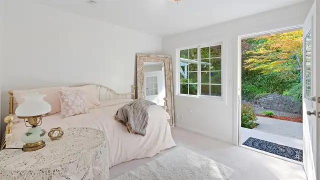 Airbnb potential? This upstairs bedroom with its own private entrance from the gorgeous back yard offers great flexibility for guests to come and go independently.