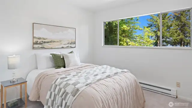 Wake up to this every day! This is the primary bedroom, the most generous in size, and it boasts beautiful water views.