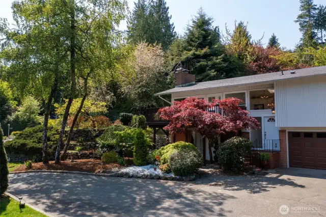 This classic split-entry home is surrounded by beautiful trees and plants flowing across the extensive terracing, adding wonderful character to the property. Discover the charm!