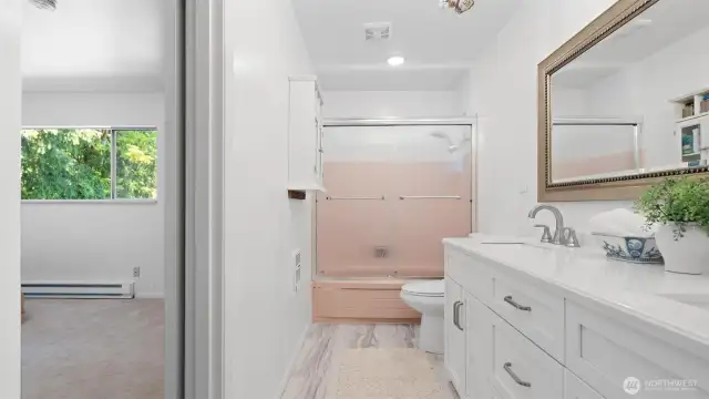 Smart design! The primary bedroom's continental bathroom provides the flexibility of a private ensuite and a shared bathroom via the hallway.
