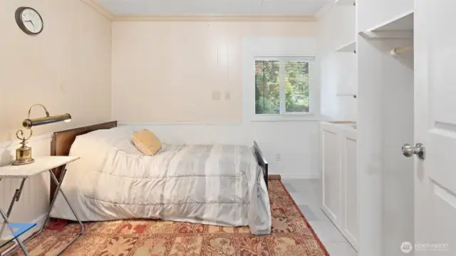 More flexible living space downstairs! This is the other bonus room, also set up as a bedroom, offering even more room to spread out.