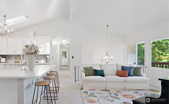 The heart of the home! With the center wall removed, this open-concept room flows beautifully, creating an incredibly inviting space for living and connecting.