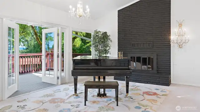 Thoughtful updates meet timeless elegance! These recently installed French doors and picture windows perfectly complement the home's character, including the stunning crystal chandeliers – the chandelier above the piano was $6,000 when new in 2006, and the chandelier next to the fireplace was $5000 when new in 2006.