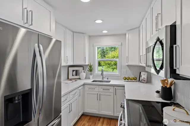 Kitchen was updated with stainless steel appliances, new cabinets, quartz counters