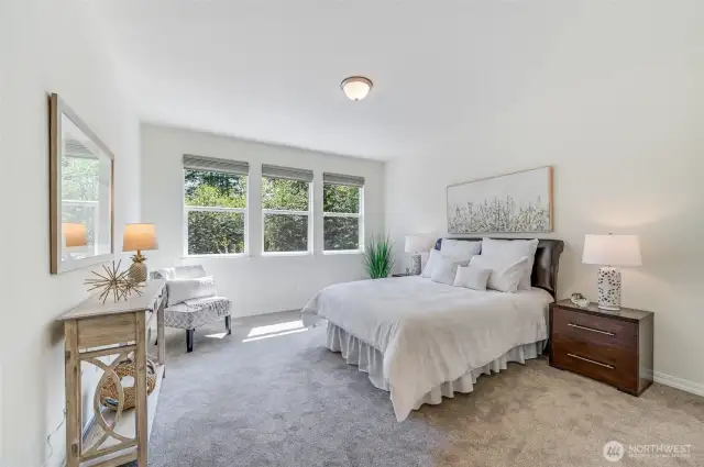 The primary bedroom can accommodate a king sized bed. New carpet in this room