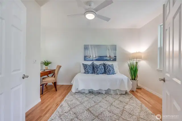 Off the entry is the office/guest bedroom with the same hardwood floors as the great room. The solid doors mean you can closet the door on a messy desk.