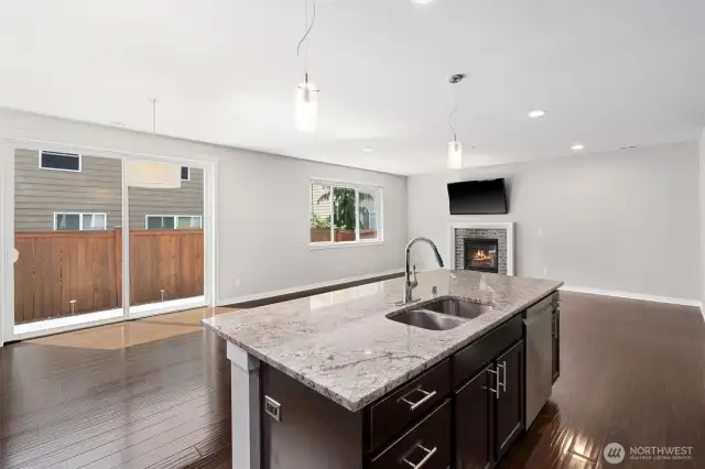 Feel the warmth from your gas fireplace, while you prepare your guest favorite dish while visiting at the Granite Island counter top.