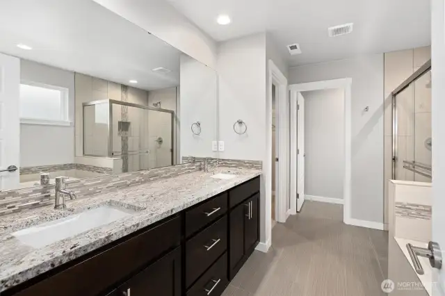 Primary 5 piece bath, granite vanity, tiled flooring & shower with separate enclosed toilet, and soaking tub!