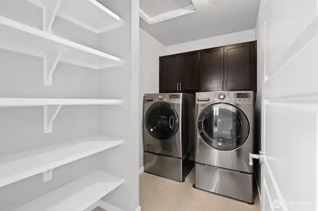 Huge laundry and linen room just across from guest rooms next to main 2nd level full bath.