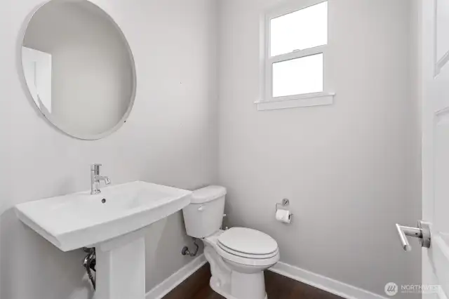Powder room/half bath just inside entrance on the way to the kitchen!