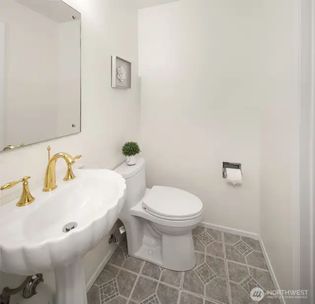 Conveniently located half bath between the primary and fourth bedroom, offering privacy and easy accessibility