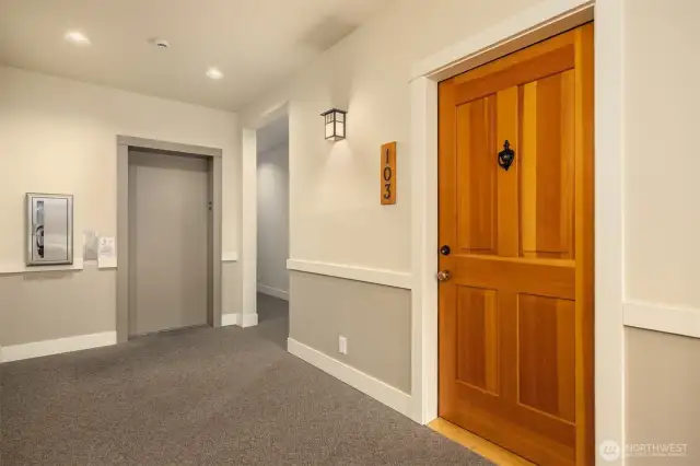 Elevator to SECURE Parking Garage and Storage. Your new front door on the right.