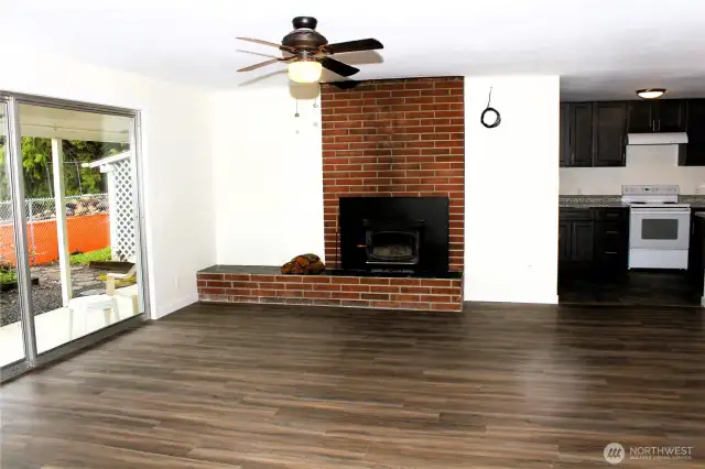 Living room with sliding door to covered patio and backyard!
