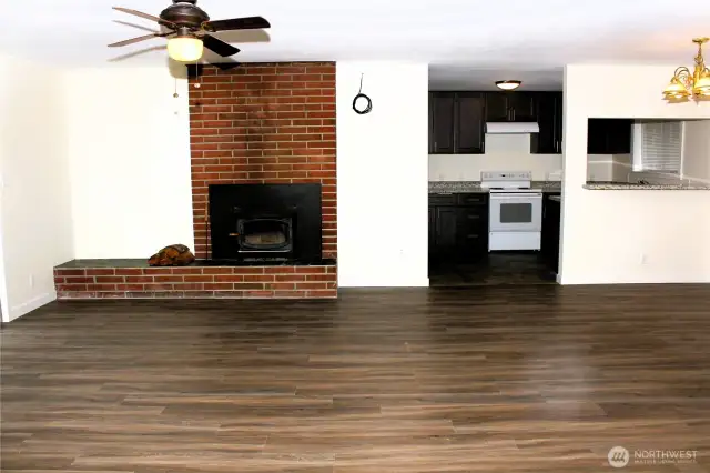 View of living and dining room, looking into kitchen.