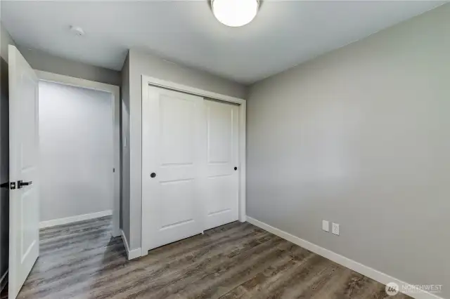Cozy and efficient third bedroom with sliding-door closet