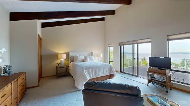 Spacious primary suite with vaulted ceilings and breathtaking Puget Sound views.