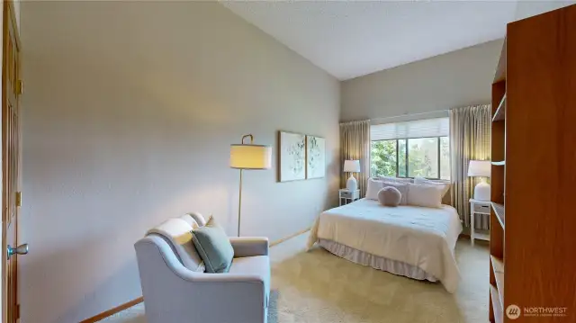 Charming third bedroom with garden views and a warm, restful atmosphere.