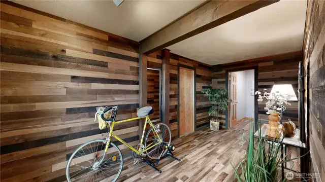 Rustic-style mudroom with versatile space perfect for storing gear, organizing outdoor essentials, or setting up a home gym or hobby area.