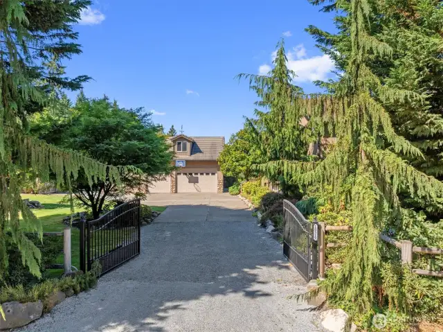 Entry to level, fully fenced 2.38 acres