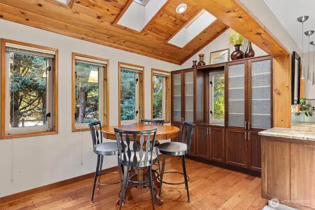 Eating nook with cabinets and skylights