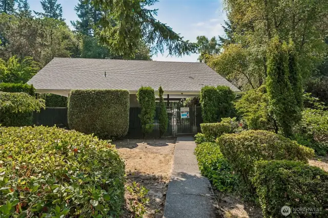 A one minute walk along a the trail in back of the home to the community outdoor pool area with bathrooms.  A portion of the area are covered and feature picnic table and chairs.