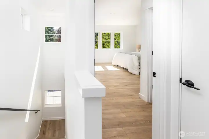 Stairway up to the tope floor bedrooms is brightly lit with southern light.