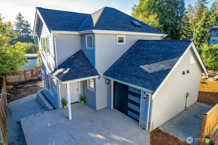 Just to the left of the photo, notice slight steps down towards the bark area of the back yard.  Gate access from alley allows for owners to pull in from that area to access the back yard and use for off street parking.