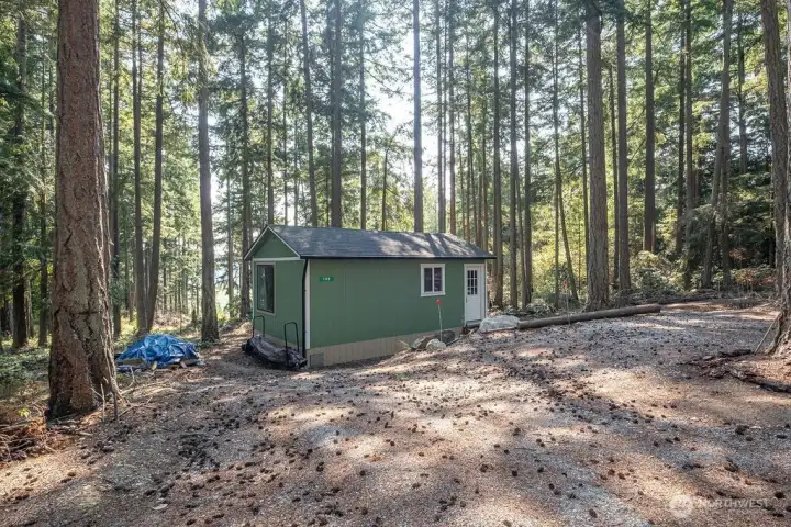 Welcome to 142 E Henni Rd in Oak Harbor. It's a 2+ acres vacant lot with a 23x14 partially finished "cabin" in the middle.