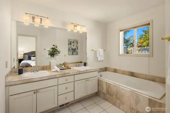 Ensuite 5-piece bath offers a double vanity, soaking tub and separate shower and walk-in closet