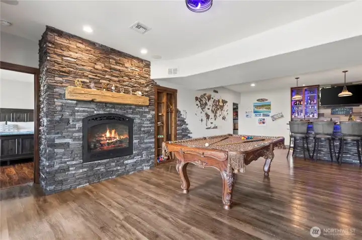 Lower level rec room fireplace and pool table