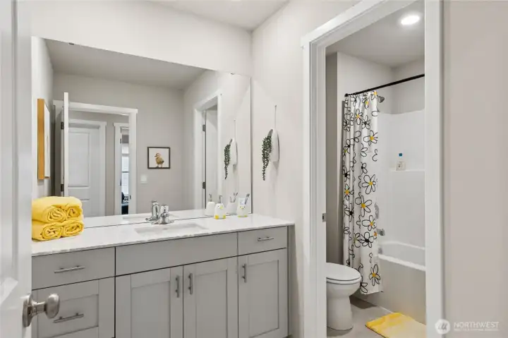 Divided hall bath. Finishes and options will vary.