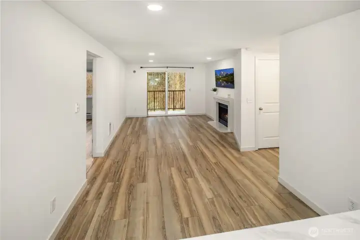 Dining and living room all one big space, looked from kitchen, so this is what you see when cooking :) newer LVP floring throughout the property.