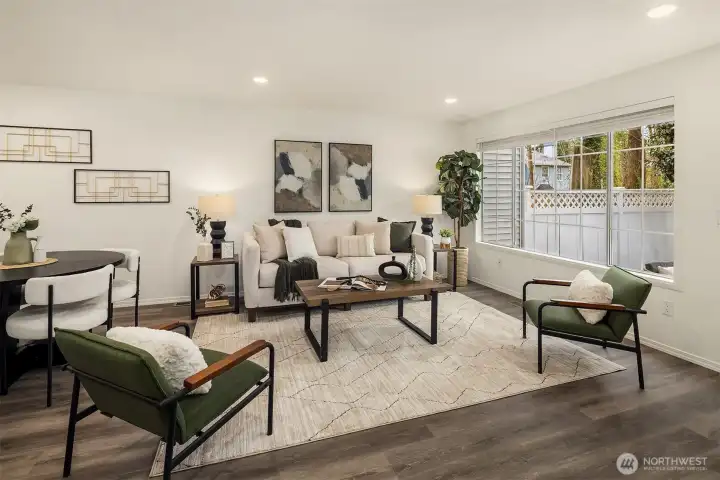 A generous space to relax or entertain. A large picture window overlooks the rear yard and fills the room with natural light.
