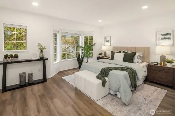 Luxurious primary suite with bay window