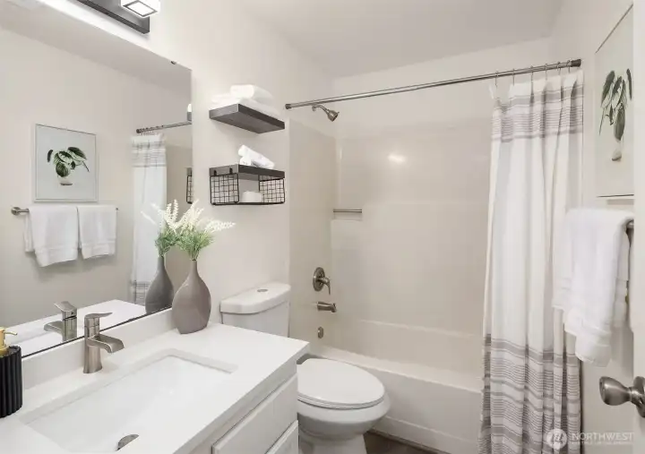 A full bath off the second primary bedroom, also fully updated!