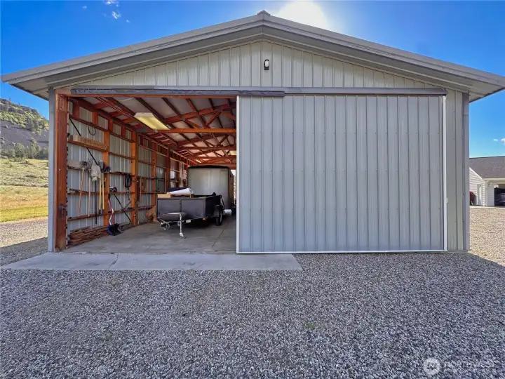 The drive-through shop is equipped with two RV hookups and offers ample space for RV storage.