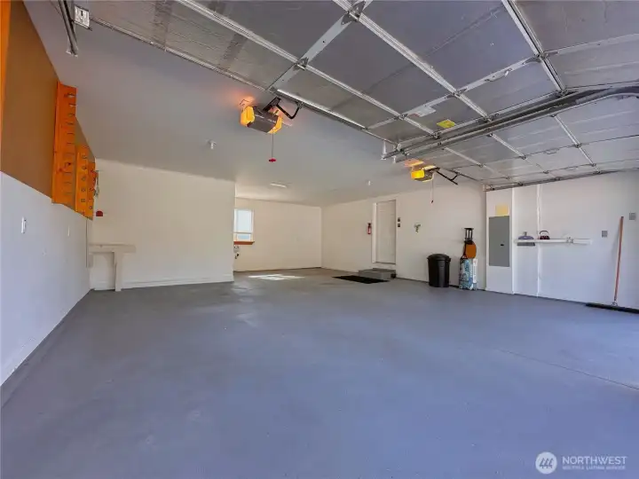 Double car attached garage with entry into utility/mudroom