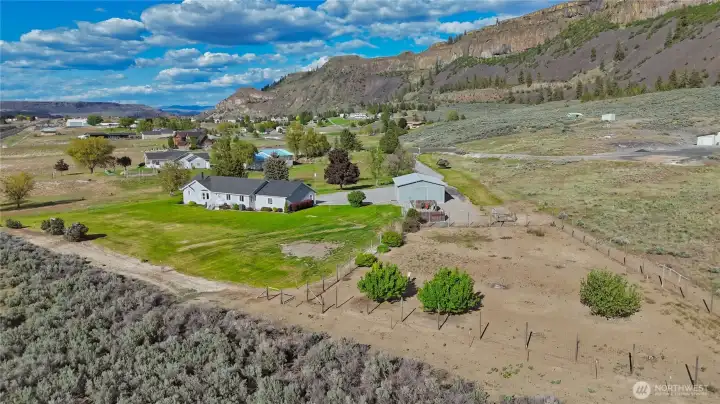 Property boundaries are clearly defined with partial fencing on 2 sides.