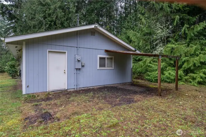 Showing the exterior door to the garage. Roof is only 10 years old.